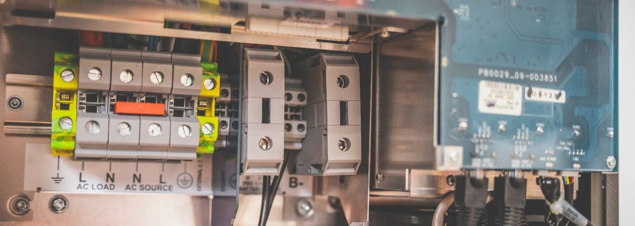Close-up view of the internal components of a solar inverter showing electrical parts.